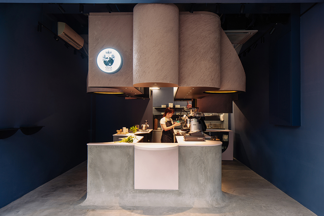 Studio SKLIM carves a café out of concrete in Singapore